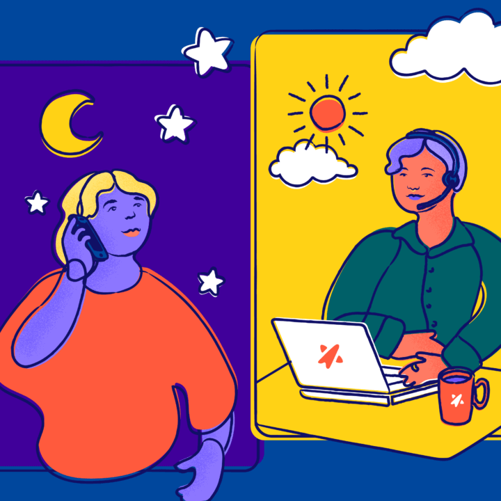 Smiling young person speaking on the phone to a happy Trevor counselor on a laptop.